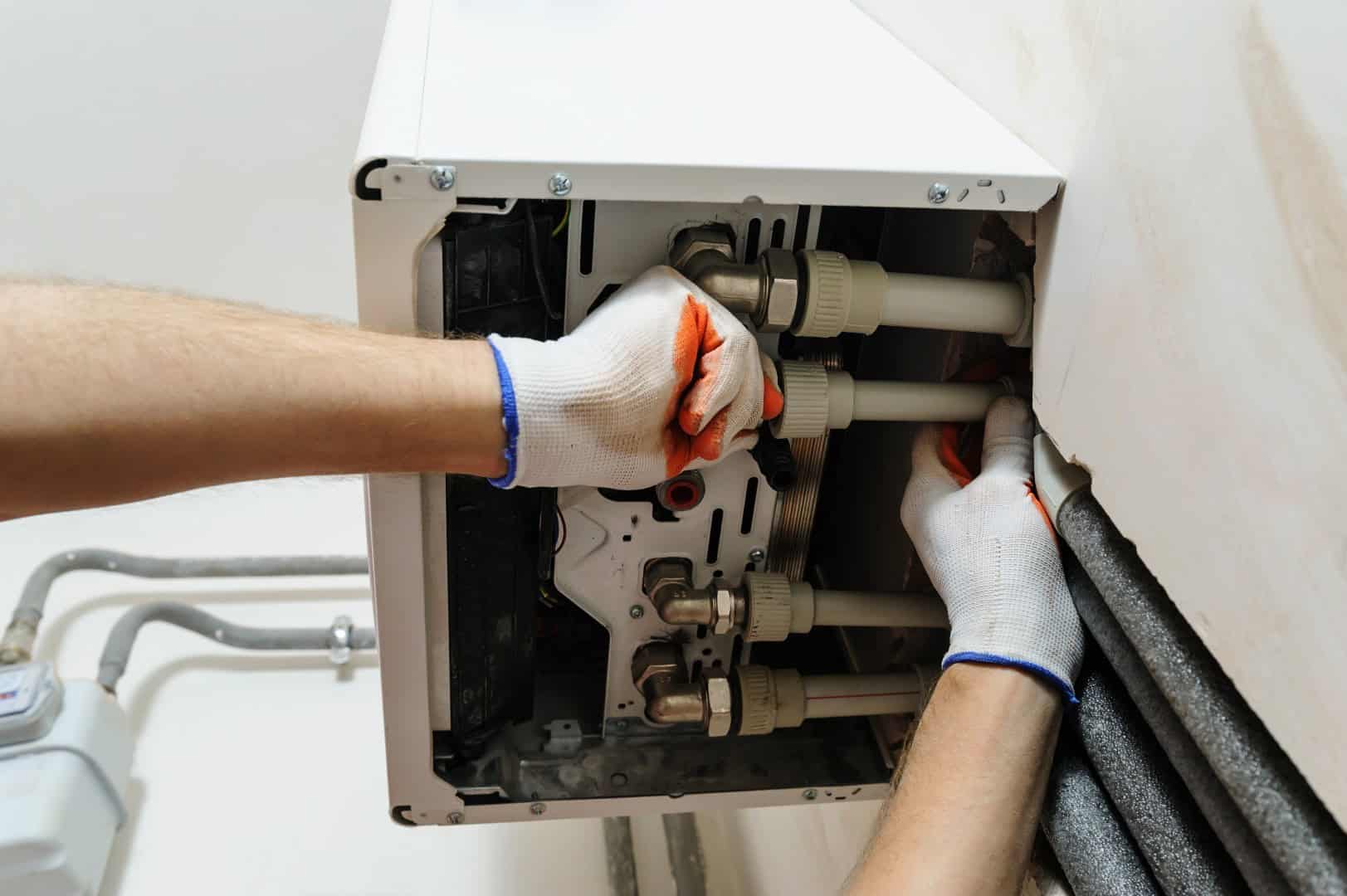 Engineer carrying out maintenance on a domestic boiler